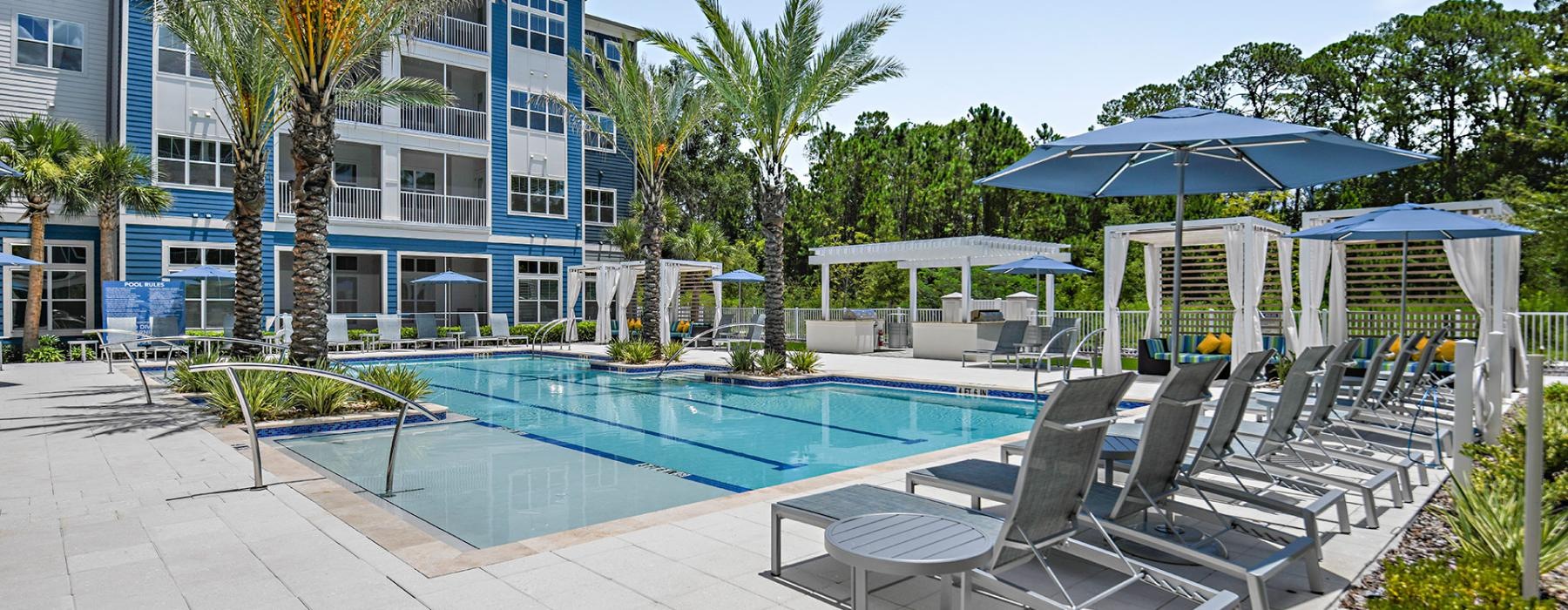 a pool with chairs around it