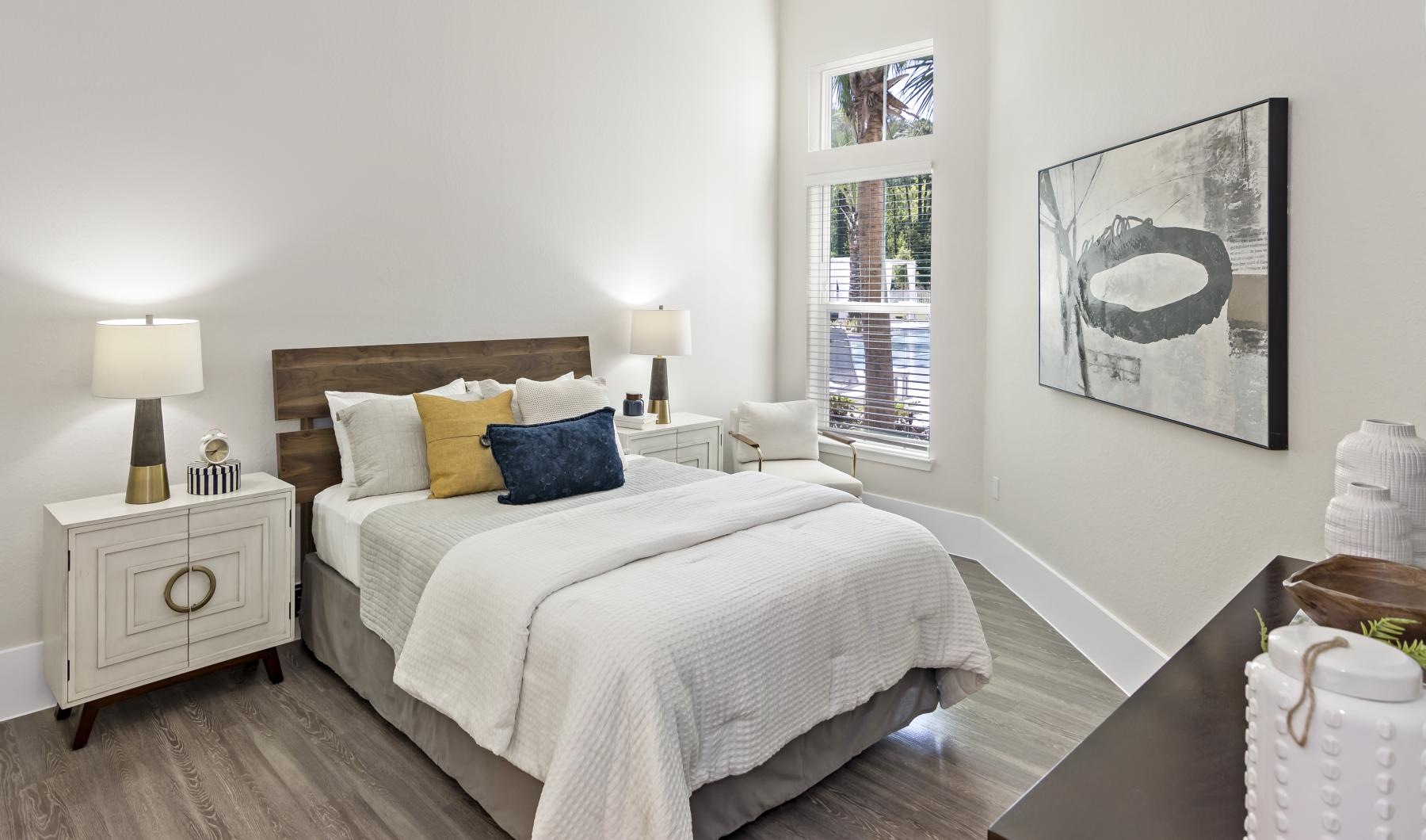 Beautiful bedrooms to fit every need a bedroom with a bed and lamps