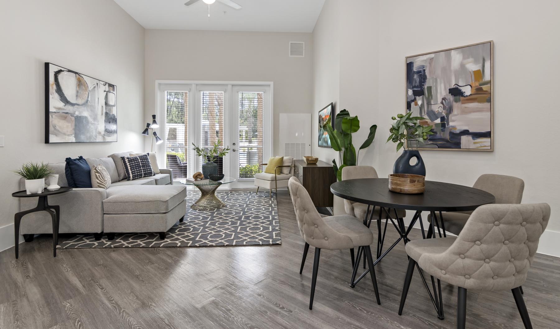 Find your perfect fit at Arya at Windermere 55+ Active Adult Living a living room with a couch and a table